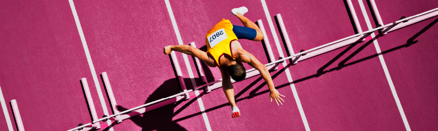 runner jumping hurdles